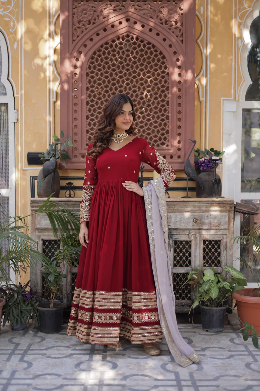 Captivating Maroon Color Faux Blooming With Embroidery Zari Sequins Work Designer Gown