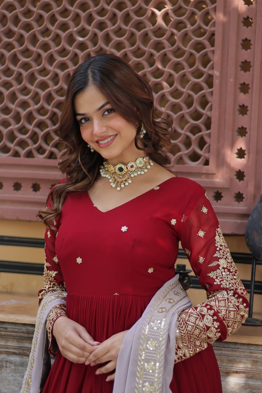 Captivating Maroon Color Faux Blooming With Embroidery Zari Sequins Work Designer Gown