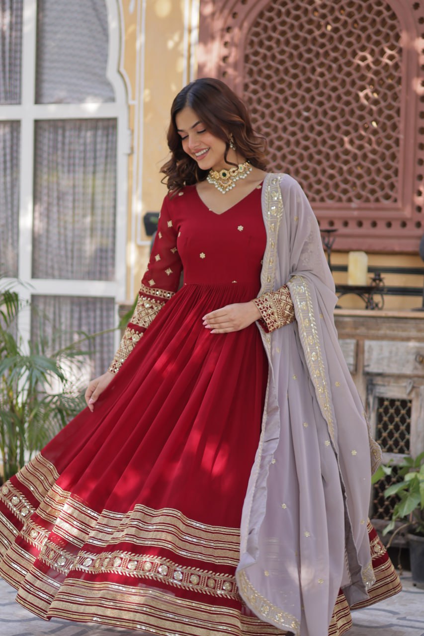 Captivating Maroon Color Faux Blooming With Embroidery Zari Sequins Work Designer Gown