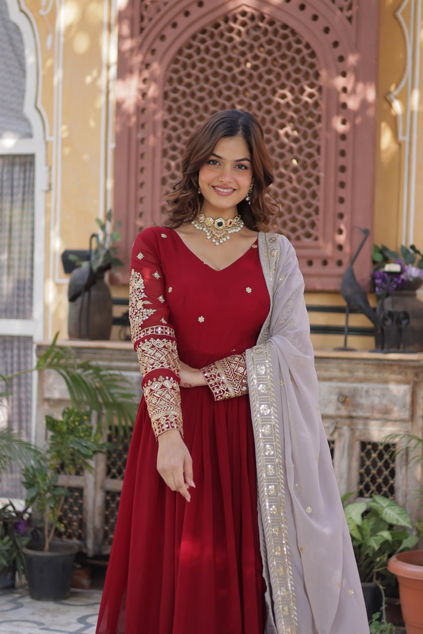 Captivating Maroon Color Faux Blooming With Embroidery Zari Sequins Work Designer Gown