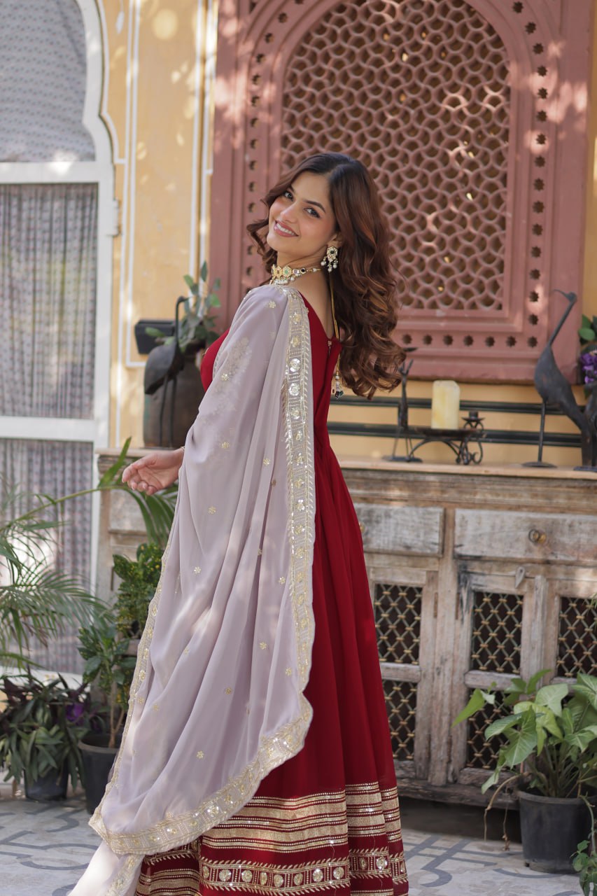 Captivating Maroon Color Faux Blooming With Embroidery Zari Sequins Work Designer Gown