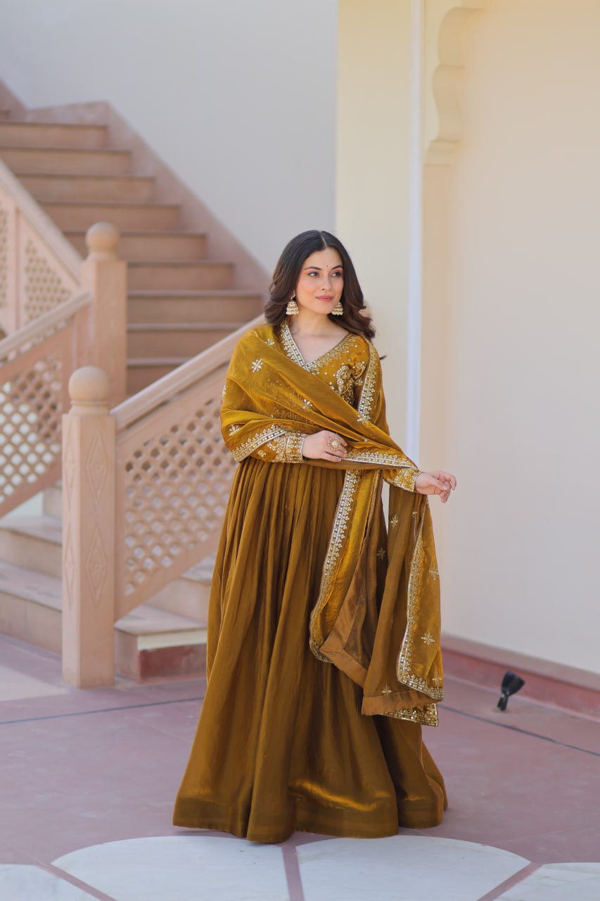 Festive Wear Mahendi Color Zari And Sequins Embroidered Work Designer Gown