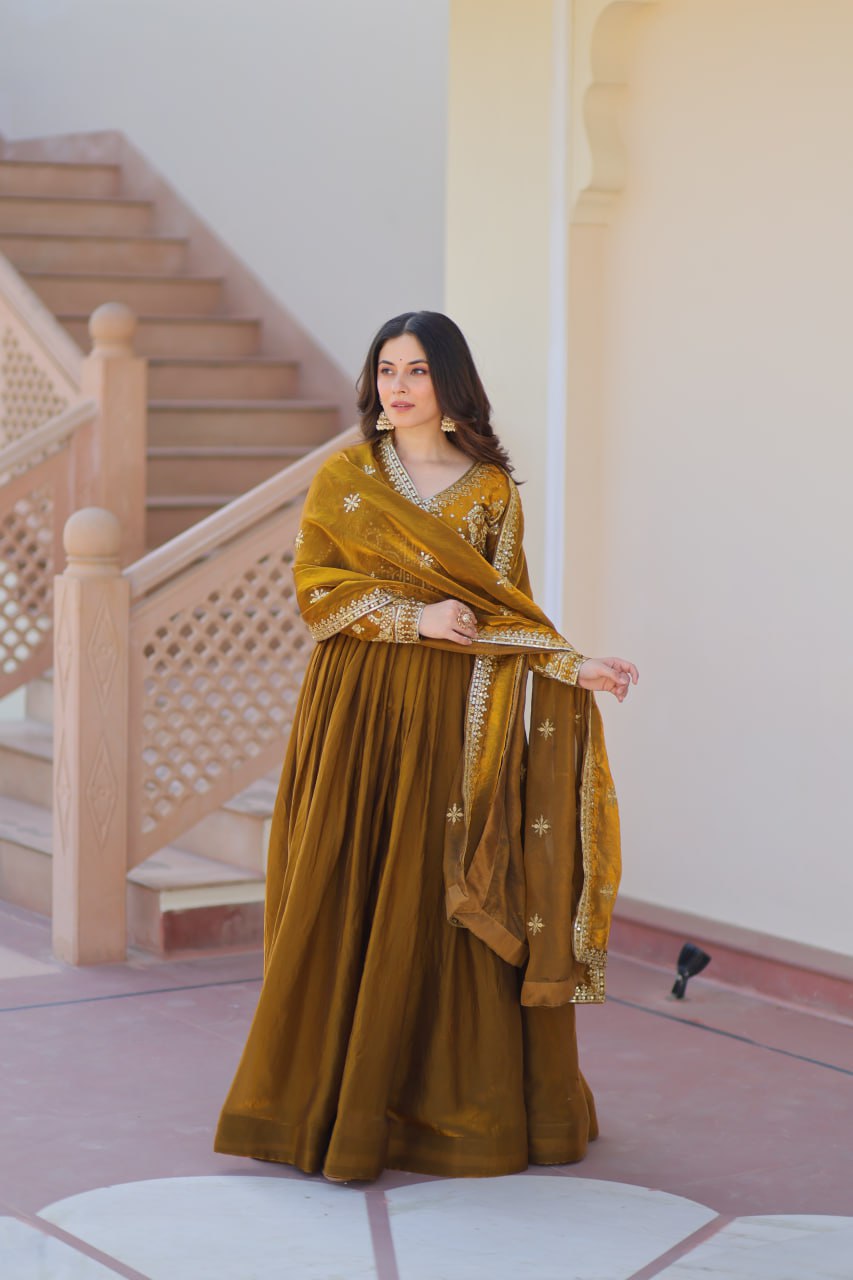 Festive Wear Mahendi Color Zari And Sequins Embroidered Work Designer Gown