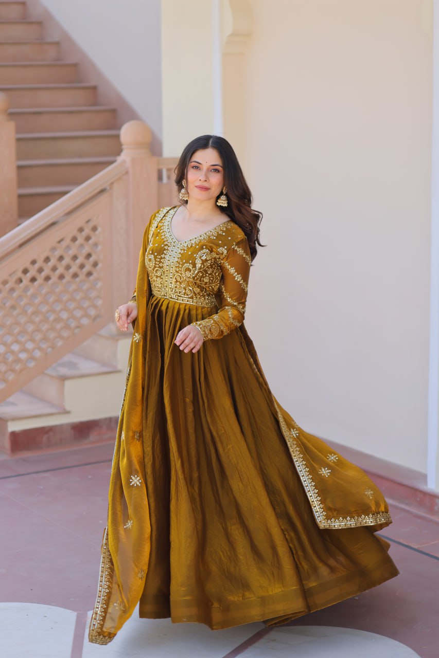 Festive Wear Mahendi Color Zari And Sequins Embroidered Work Designer Gown