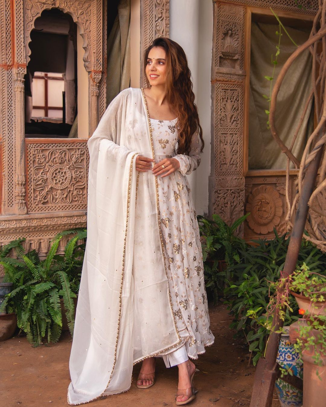 Admiring Embroidery Sequence Work White Color Gown