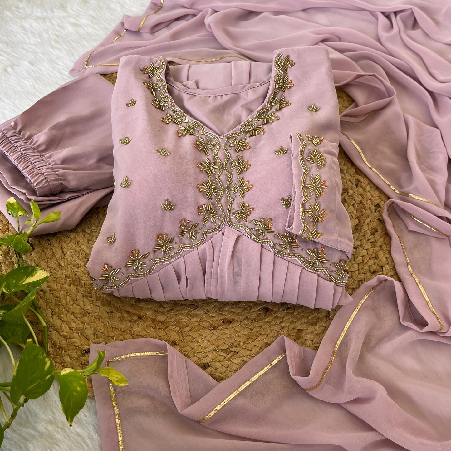 Delightful Dusty Peach Color Georgette With Hand Work Party Wear Gown