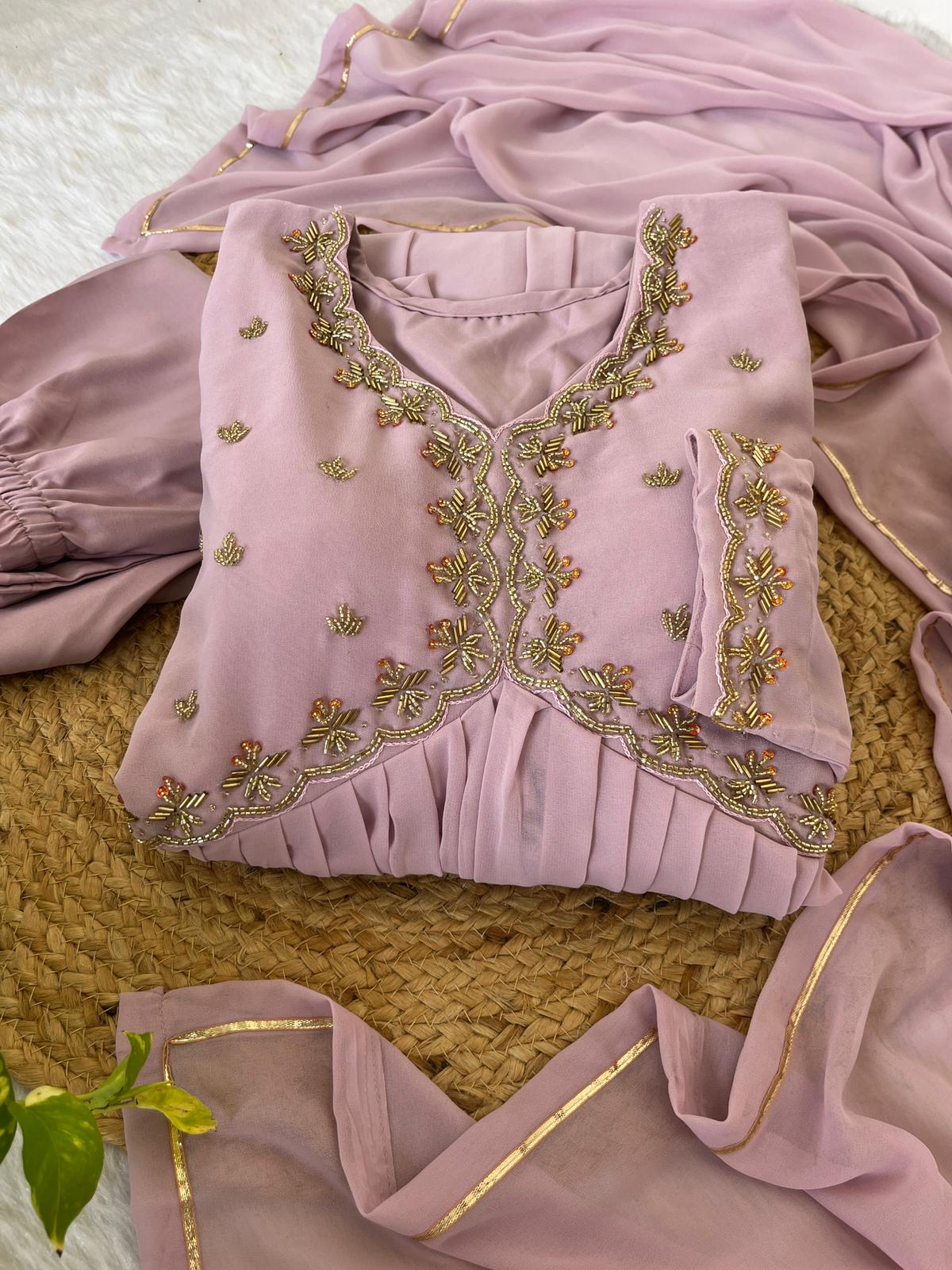 Delightful Dusty Peach Color Georgette With Hand Work Party Wear Gown