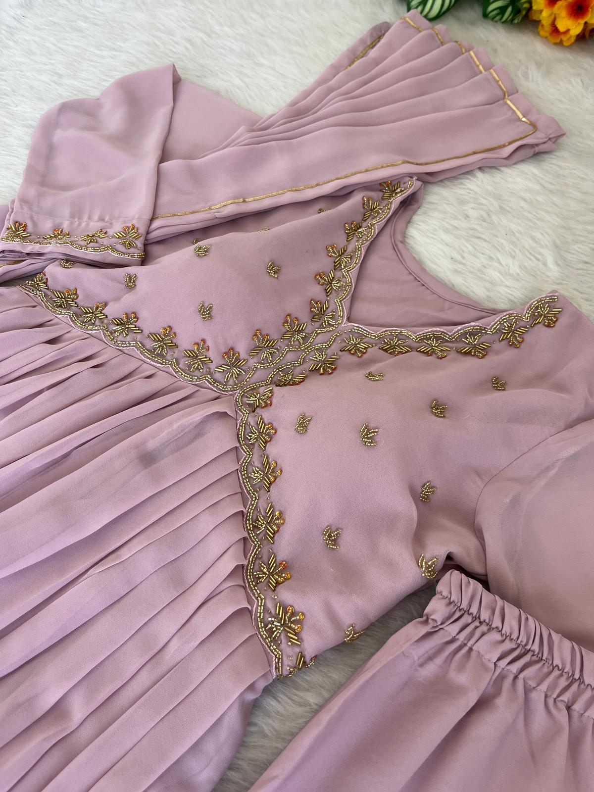 Delightful Dusty Peach Color Georgette With Hand Work Party Wear Gown