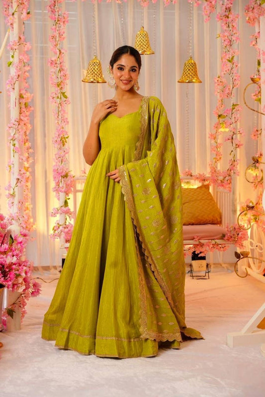 Glimmering Mustard Color Heavy Roman Silk With Fancy Lace Designer Gown